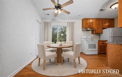 Escape to this charming and affordable lake retreat, just - photo 2