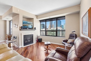 Elevated above the city on the 19th floor, this stunning corner - photo 1