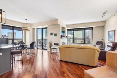 Elevated above the city on the 19th floor, this stunning corner - photo 2