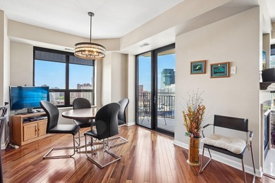 Elevated above the city on the 19th floor, this stunning corner - photo 8