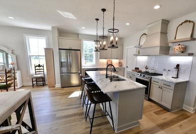 Discover elevated coastal living in Whittaker Point, one of - photo 10