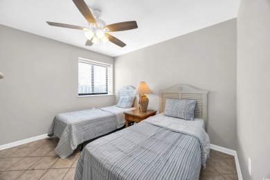 This beautifully maintained four-bedroom, end unit oceanfront