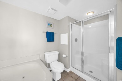 This beautifully maintained four-bedroom, end unit oceanfront