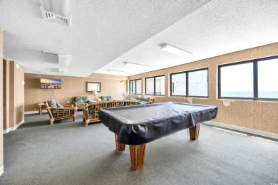 This beautifully maintained four-bedroom, end unit oceanfront