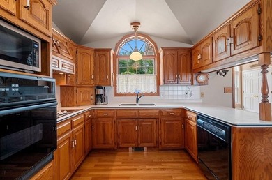 Beautiful arched-window entry welcomes you to this inviting lake - photo 15