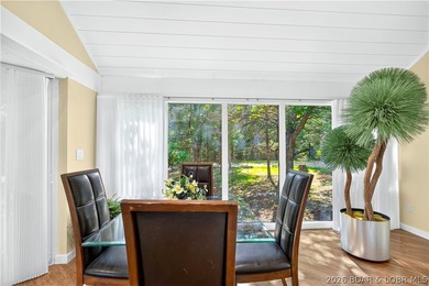 Distinctive architecture meets effortless lake living in this - photo 20