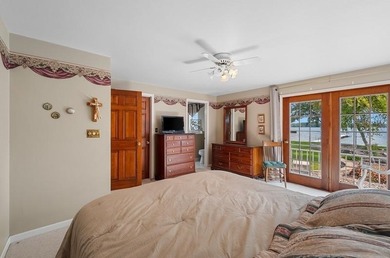 Beautiful arched-window entry welcomes you to this inviting lake - photo 31