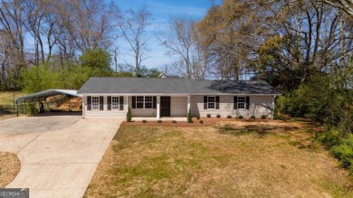 Lake Home For Sale in Flowery Branch, Georgia