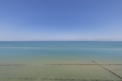 This 20,000-square-foot lot overlooking Lake Michigan is part of - photo 11