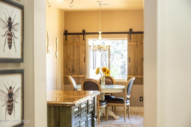 This charming 2013 single-level Tuscan Style custom residence in