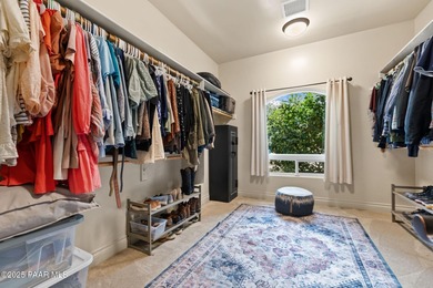 This charming 2013 single-level Tuscan Style custom residence in