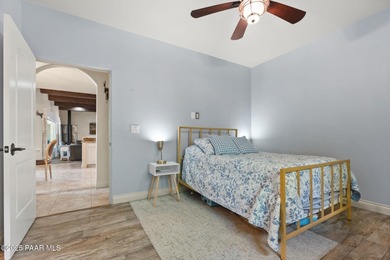 This charming 2013 single-level Tuscan Style custom residence in