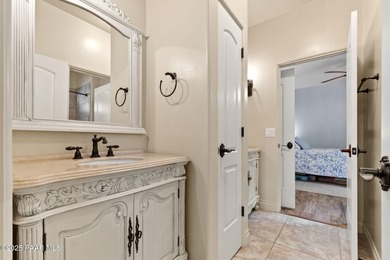 This charming 2013 single-level Tuscan Style custom residence in