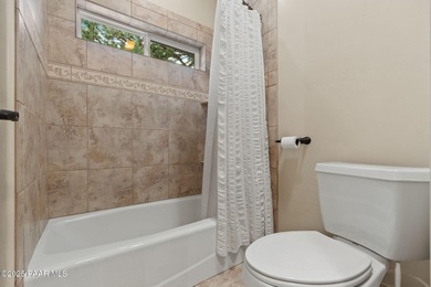 This charming 2013 single-level Tuscan Style custom residence in