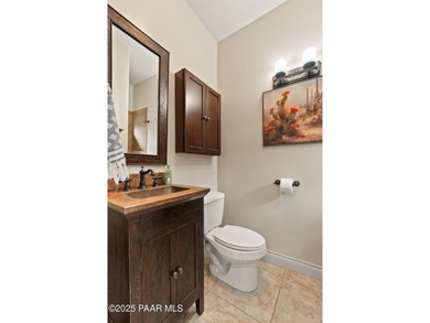 This charming 2013 single-level Tuscan Style custom residence in