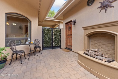 This charming 2013 single-level Tuscan Style custom residence in