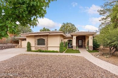 This charming 2013 single-level Tuscan Style custom residence in