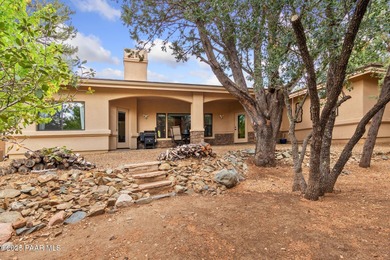 This charming 2013 single-level Tuscan Style custom residence in