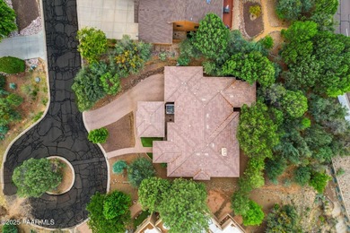 This charming 2013 single-level Tuscan Style custom residence in