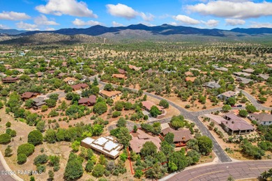 This charming 2013 single-level Tuscan Style custom residence in