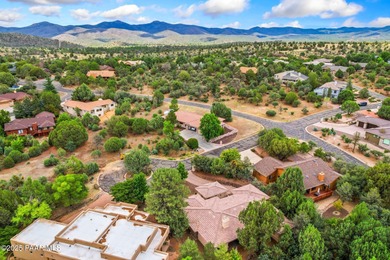 This charming 2013 single-level Tuscan Style custom residence in