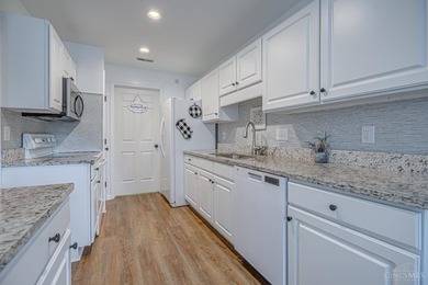 Welcome home to easy, low-maintenance living in the beautifully - photo 9