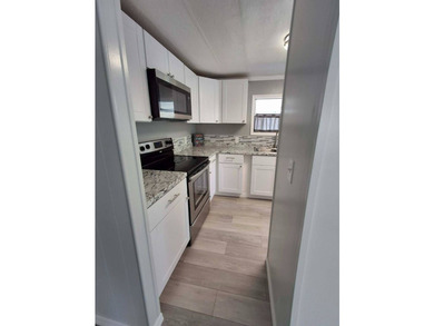 Check out this beautiful waterfront mobile home located in - photo 5