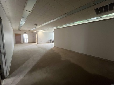 This three-story limestone office building totals approximately