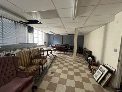 This three-story limestone office building totals approximately