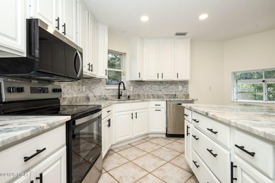 Welcome to this beautifully renovated 5-bedroom, 2.5-bath pool - photo 13