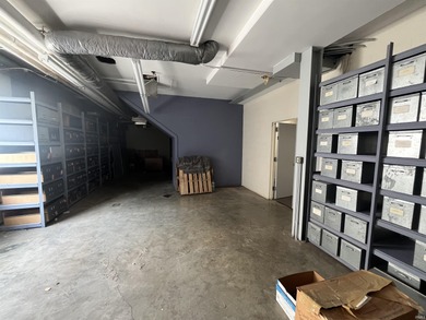 This three-story limestone office building totals approximately