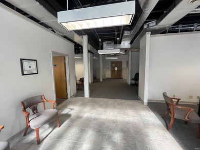 This three-story limestone office building totals approximately