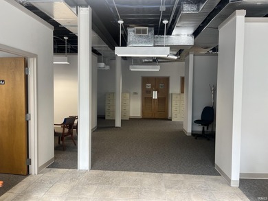 This three-story limestone office building totals approximately