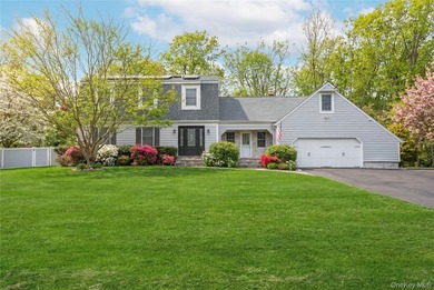 Set within the serene landscape of Rolling Woods in Riverhead - photo 1