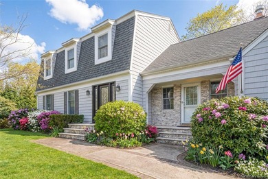 Set within the serene landscape of Rolling Woods in Riverhead - photo 4