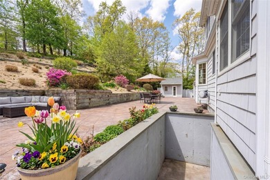 Set within the serene landscape of Rolling Woods in Riverhead - photo 9