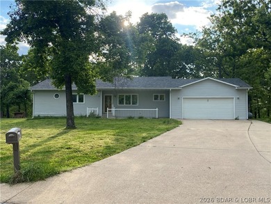 This home checks a lot of boxes: Location, blacktop to your door - photo 1