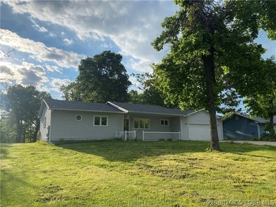 This home checks a lot of boxes: Location, blacktop to your door - photo 3