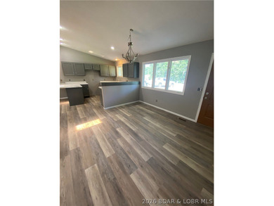 This home checks a lot of boxes: Location, blacktop to your door - photo 10