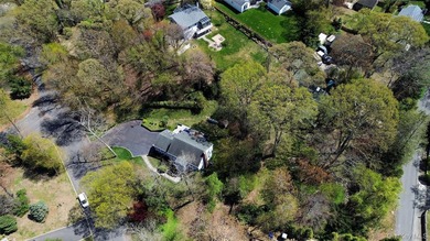 Nestled on a secluded, lushly landscaped three-quarter-acre - photo 2