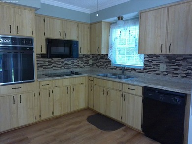 Welcome to The Wilds, a desirable active adult community! This - photo 3