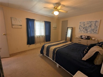 This lovely home is located in a 55+ community where you own - photo 16
