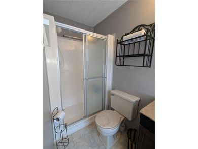 This lovely home is located in a 55+ community where you own - photo 18