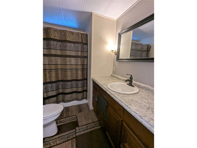 This lovely home is located in a 55+ community where you own - photo 22