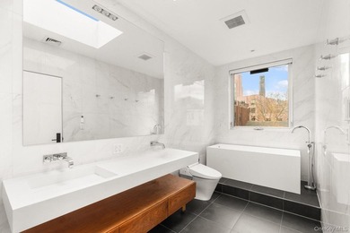 Welcome home to 140 Clinton Avenue, a meticulously maintained - photo 8