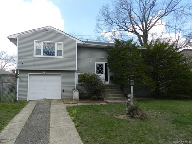 Spacious 4 Bedroom, 2 Bath High Ranch with Garage.Large Living - photo 1