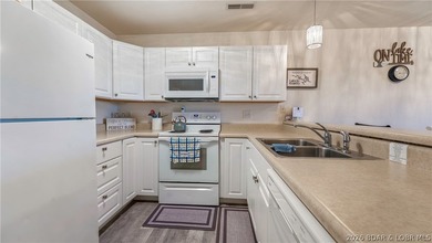 Wake up to peaceful cove views from your screened deck at this - photo 4