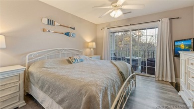 Wake up to peaceful cove views from your screened deck at this - photo 8