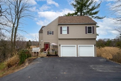 Situated at 12 Cedar Dr in Webster, MA, United States, this - photo 1