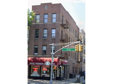 This four-story mix use building has 1 store and 7 families, 3 - photo 1